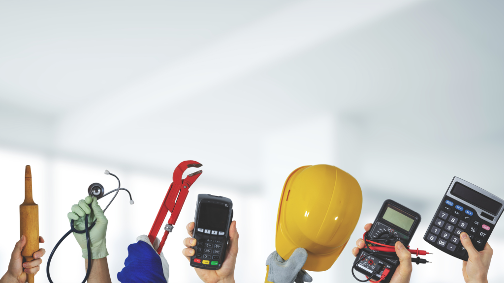 Group of hands holding various tools—hammer, screwdriver/wrench, pliers, stethoscope, calculator, and a yellow hard hat.